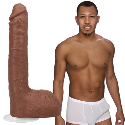 Ricky Johnson is shirtless with an erection in his underwear, standing next to the Signature Cocks - Ricky Johnson dildo, lifecast directly from his own shaft. | Kinkly Shop