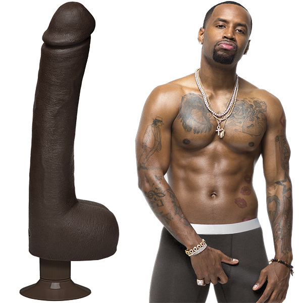 Safaree is shirtless and staring into the camera while grabbing his underwear bulge. The Signature Cocks - Safaree Ultraskyn Vibrating dildo is shown next to Safaree. | Kinkly Shop