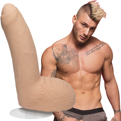 A shirtless William Seed looks into the camera. The Signature Cocks - William Seed dildo is shown next to the shirtless model. | Kinkly Shop