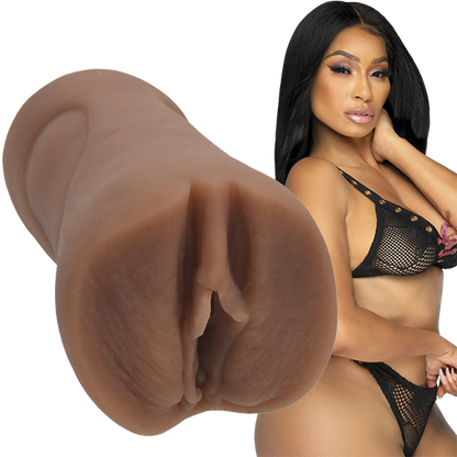 Karlie Redd is wearing lingerie and staring into the camera. The Signature Strokers Camgirls Karlie Redd stroker is shown next to the porn star. | Kinkly Shop