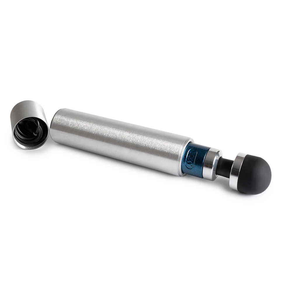 The Doxy Die Cast 3R shown inside of its storage tube. It comes inside of an aluminum storage tube for safe keeping during travels. | Kinkly Shop