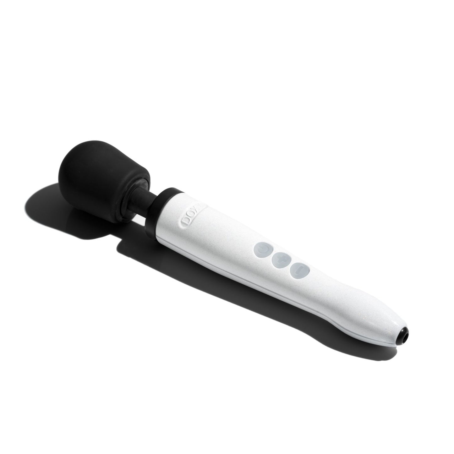 The Doxy Die Cast R lays in the sunlight, a harsh black shadow cast next to it from the strong rays. | Kinkly Shop