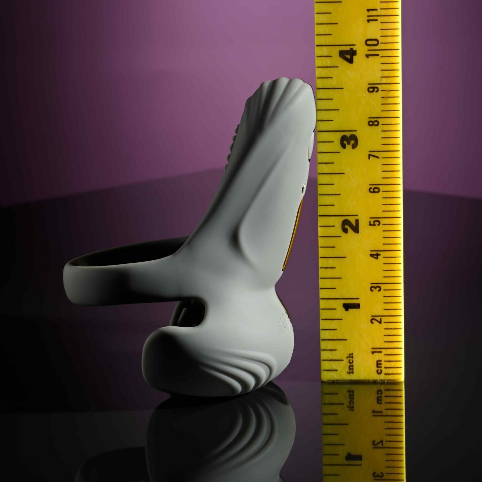 The Evolved Undercarriage propped upright next to a bright yellow ruler. It reaches about 3.5" in total length next to the ruler despite the bend in the design of the toy. | Kinkly Shop