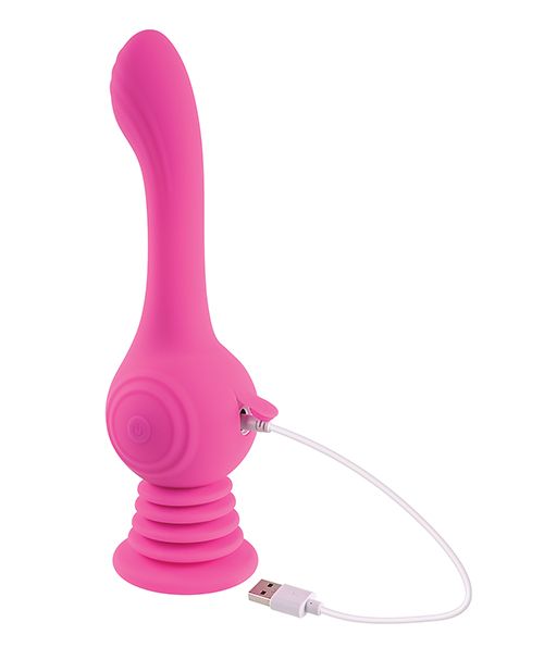 The Evolved Gyro Vibe sits upright against a white background. The charging cable is plugged into the base of it with the small, silicone "door" opened to expose the charging port. The opposite end of the charging cable is a plain USB. | Kinkly Shop