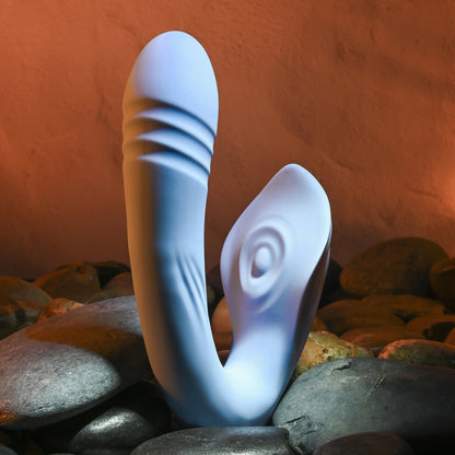 Shadowed view of the Evolved Tap & Thrust showcases the thrusting ribbing of the shaft as well as the tapping clitoral stimulator in the middle of a sting-ray-like winged arm | Kinkly Shop