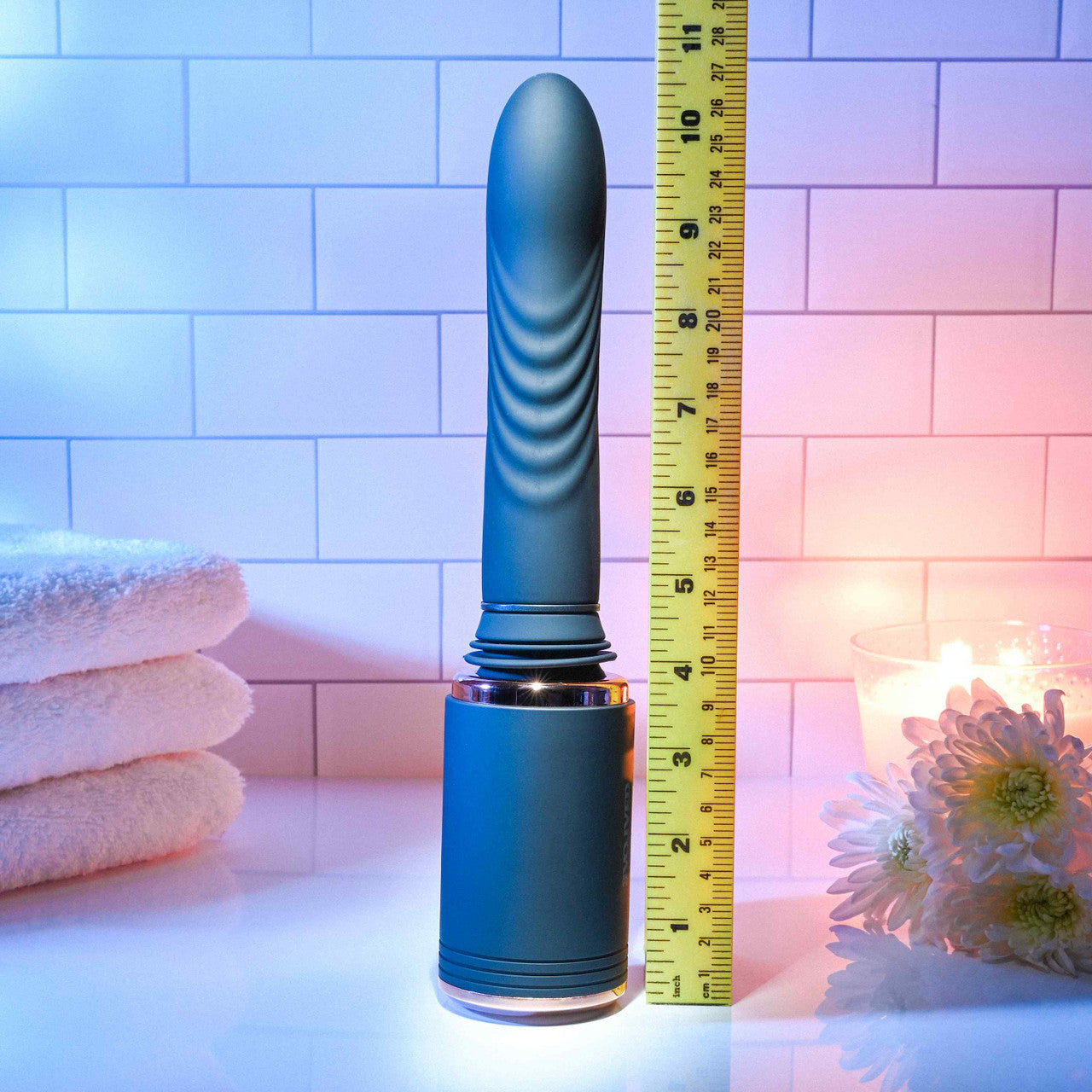 The Evolved Too Hot to Handle Thrusting Machine sitting upright next to a ruler. It's over 10" in total length. | Kinkly Shop