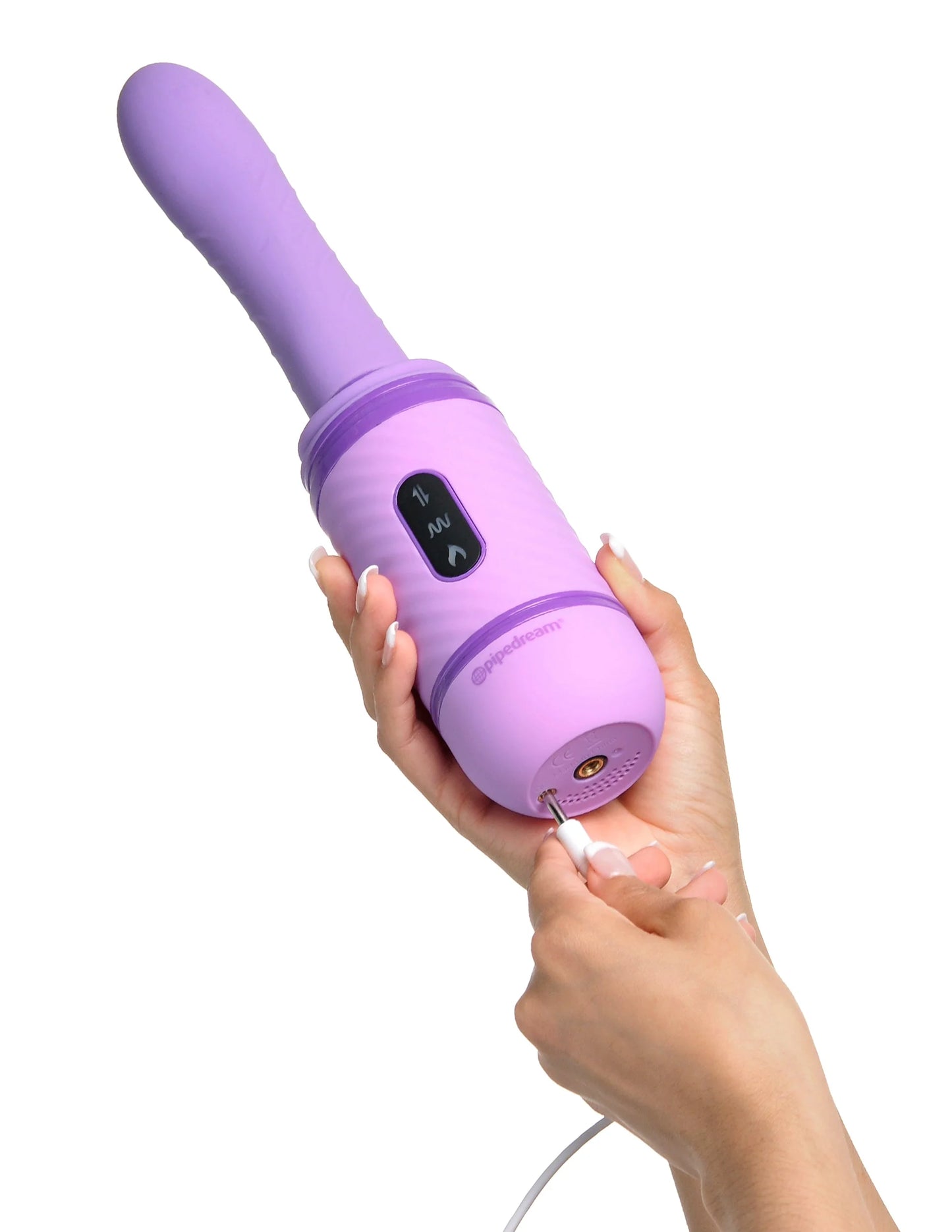 A hand plugs the charging cable for the Fantasy For Her Love Thrust Her into the base of the toy. The charging port is at the very bottom of the toy, next to the screw-on area for the suction cup attachment. | Kinkly Shop