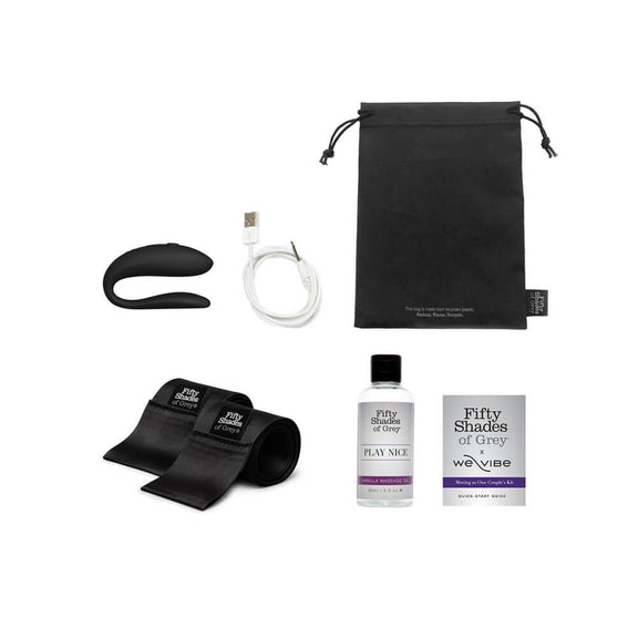 Everything that's included in the Fifty Shades of Grey Moving as One Kit. There's the We-Vibe vibrator, the charging cable, the storage bag, the Fifty Shades of Grey branded satin ties, the Vanilla Massage Oil, and a quick start guide. | Kinkly Shop