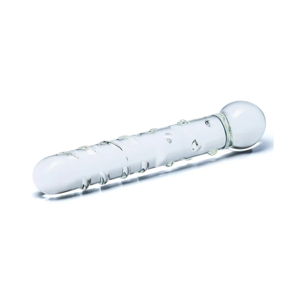 The Glas Callisto dildo lays sideways, showcasing the noduled shaft alongside the swirling ribs along the shaft. | Kinkly Shop