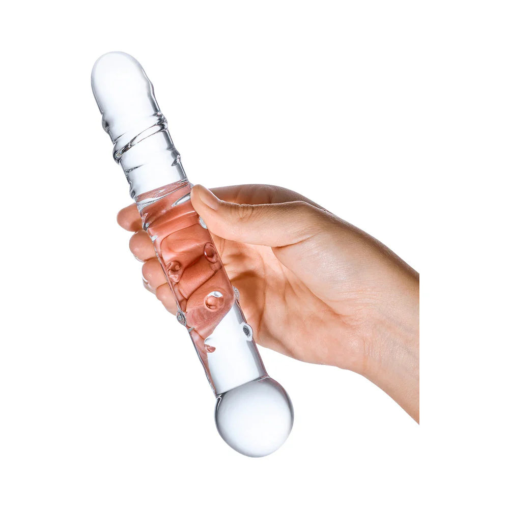 A hand holds the Glas Callisto dildo. The dildo looks slender in the person's hands. The diameter is thinner than two fingers' width. | Kinkly Shop