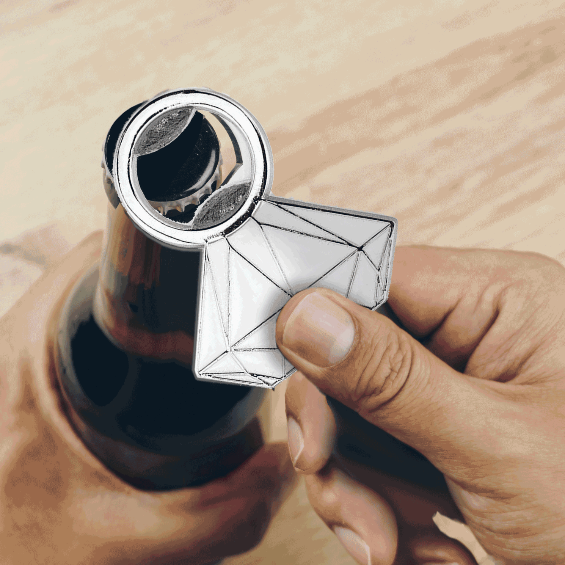 A person uses the Glitterati Diamond Ring Bottle Opener to open a beer bottle. The wide "diamond" design makes an easy, wide gripping surface for use. | Kinkly Shop
