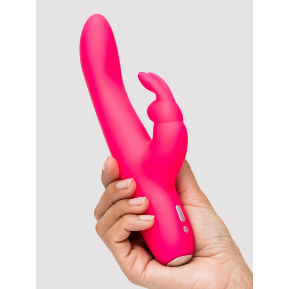 A hand grips the Happy Rabbit Slimline Curve. The toy looks like it fits comfortably in their hand. The shaft looks slender and smooth. | Kinkly Shop