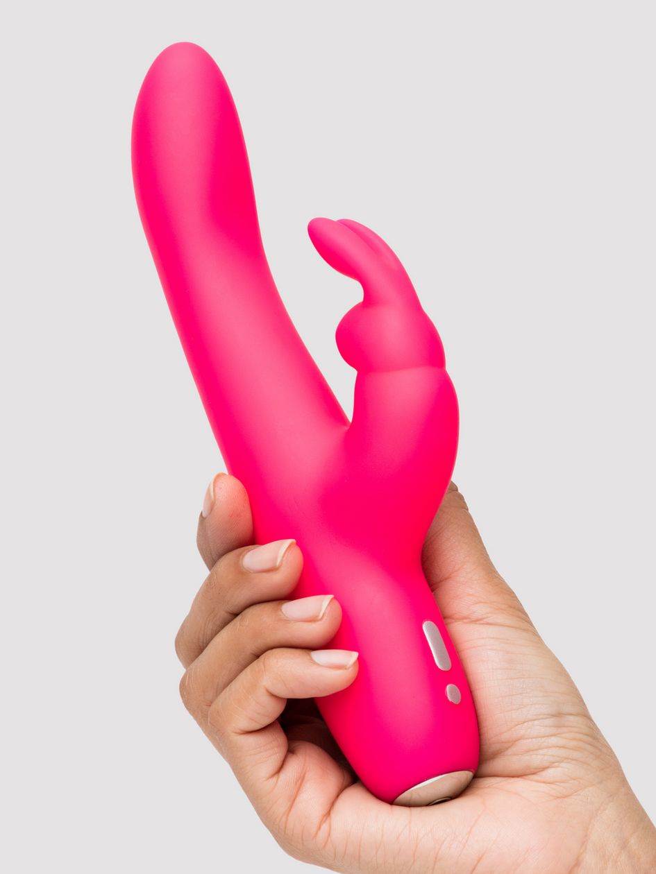 A hand grips the Happy Rabbit Slimline Curve. The toy looks like it fits comfortably in their hand. The shaft looks slender and smooth. | Kinkly Shop