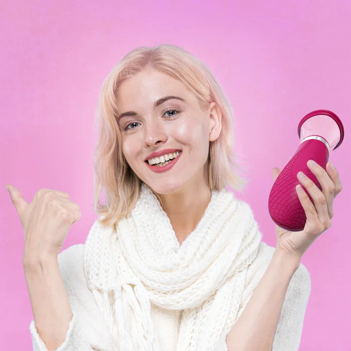 A person holds the Scioness. The vibrator looks slightly large in her hand - almost about the width of holding a can of soda. | Kinkly Shop