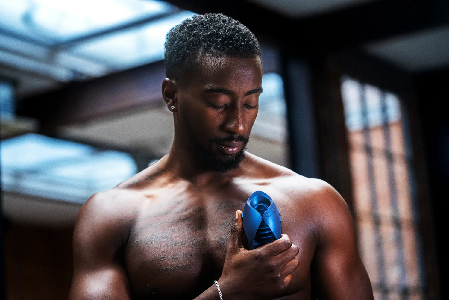 A person holds the Hot Octopuss Pulse Solo Essential - Limited Edition. The toy looks particularly short in length and easy to grip. | Kinkly Shop