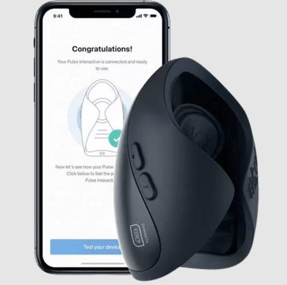The Hot Octopuss Pulse Solo Interactive vibrator shown in front of a cell phone opened up to the app that's currently pairing with the sex toy. | Kinkly Shop