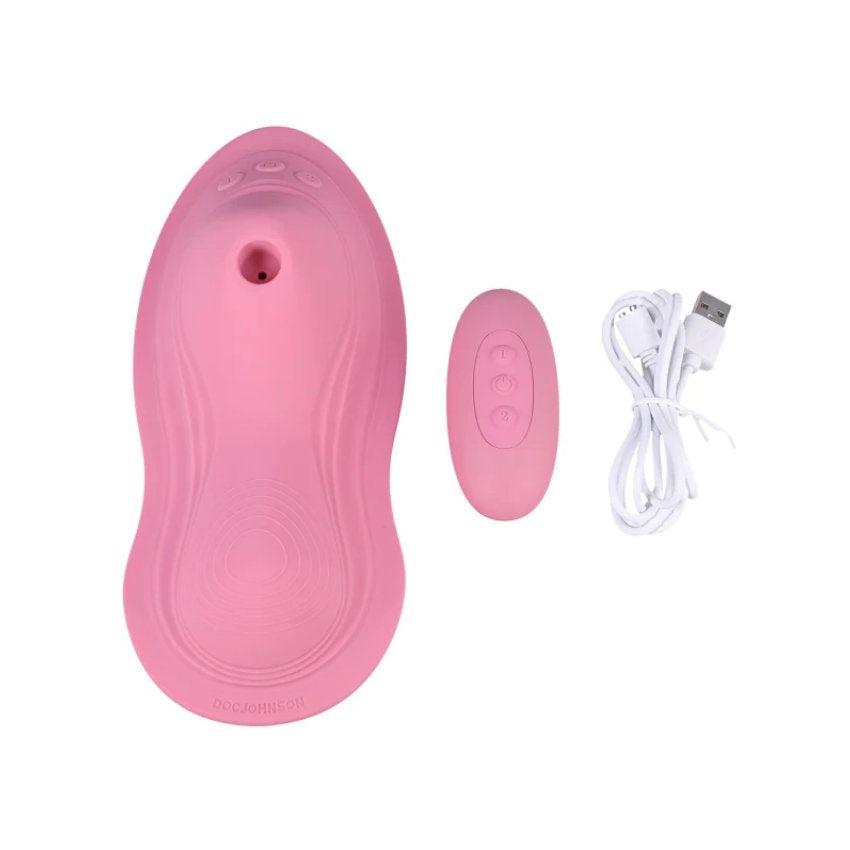 The iRide Pleasure Seat iSuck shown next to the wireless remote and charging cable that it comes with. | Kinkly Shop