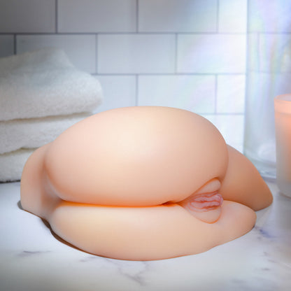 Close-up of the Kendra Spade Realistic Side Stroker's hips and waist. It shows the lower back design that's built into the stroker too. | Kinkly Shop