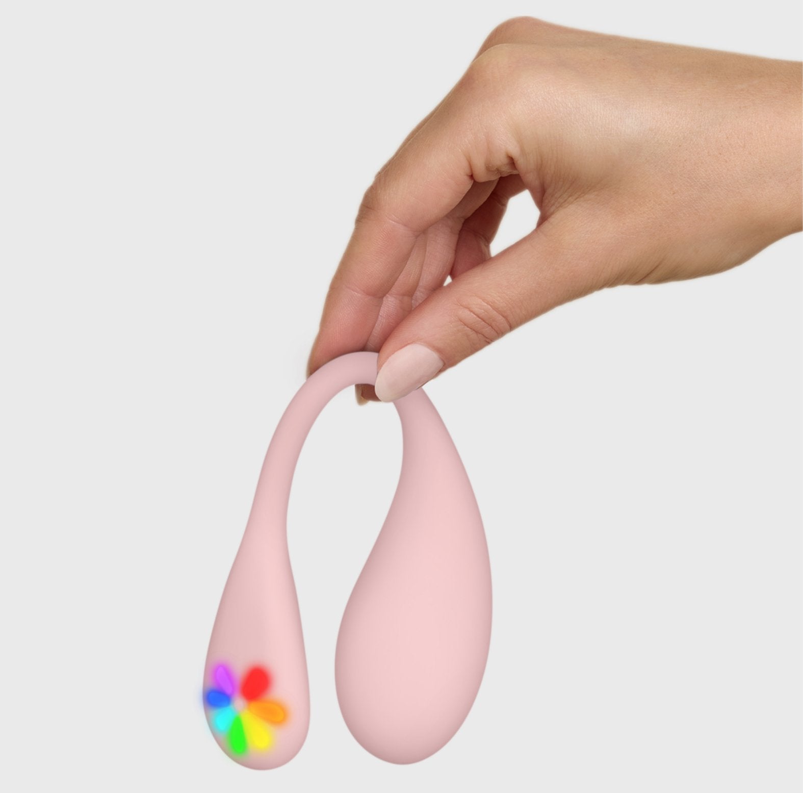 A hand holds the KIIROO Spot by its tail. The vibrator holds its shape comfortably. | Kinkly Shop