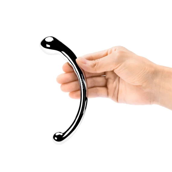 A hand holds the Le Wand Mini Pleasures Kit, showcasing the very intense half-moon shape of the Le Wand Hoop that makes it great for g-spot pleasure. | Kinkly Shop