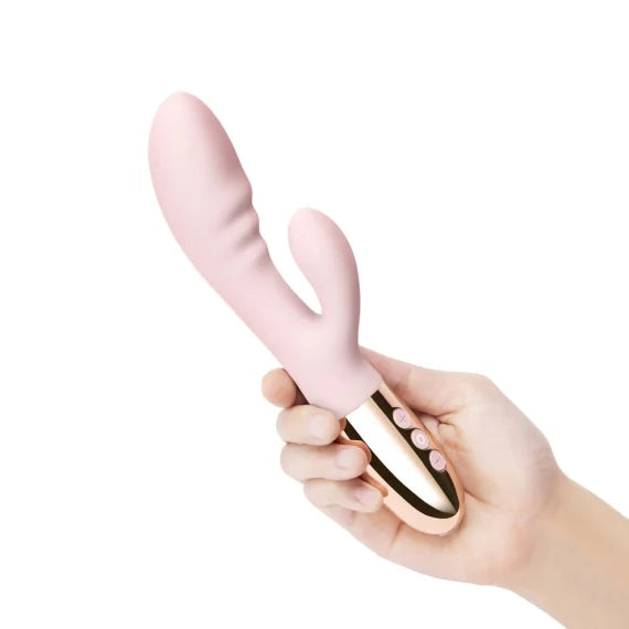 A hand holds the Le Wand Blend vibrator. The base of the vibrator looks comfortable in the person's hand. | Kinkly Shop
