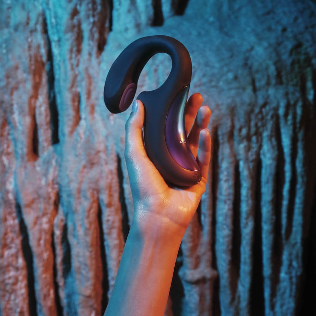 A person has the LELO Enigma Double Sonic in their hand. The handle looks particularly thick and easy to grip. | Kinkly Shop