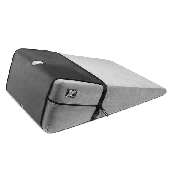 The Liberator Birdi Sex Toy Mount Add-On for the Ramp wrapped on the Ramp shape. It looks like a long, flat waterproof pad with multiple holes in it to mount your favorite sex toys in the Birdi. | Kinkly Shop