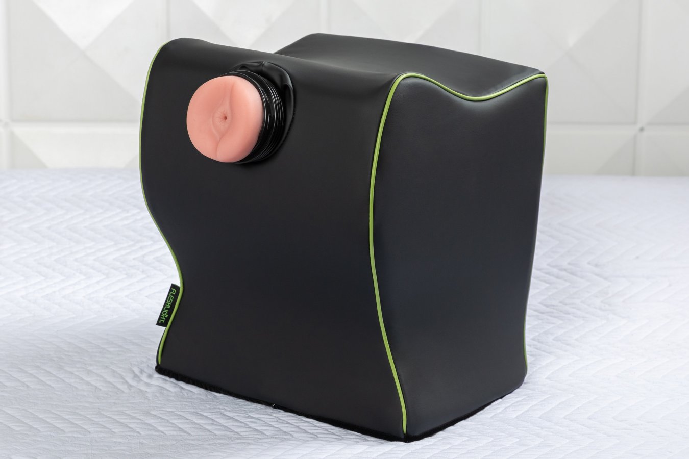 The Liberator Fleshlight Top Dog on top of a flat surface. A Fleshlight is shoved into the sex toy mount hole of the Liberator Fleshlight Top Dog to showcase how it would work for hands-free doggy style sex. | Kinkly Shop