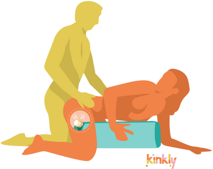 Illustration shows a couple using the Liberator Wing. The receiving partner is on their hands and knees in doggy style. The penetrating partner is kneeling behind them in doggy style. The Liberator Wing is tucked underneath the receiver, supporting the receiver's body weight. An X-Ray see-through panel shows a wand massager being held and buzzing inside the Wing. | Kinkly Shop