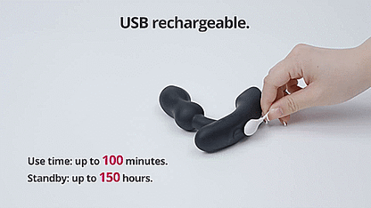 GIF shows a magnetic charging cord attached to the base of the Lovense Edge 2. Text on the GIF reads "USB Rechargeable. Use time up to 100 minutes. Standby up to 150 hours." | Kinkly Shop
