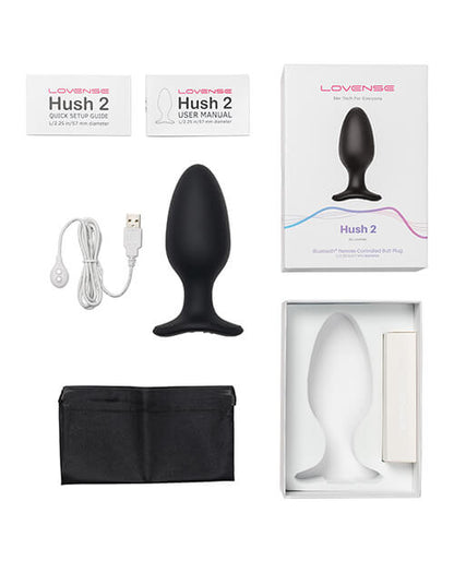 Everything included with the Lovense Hush 2 including the user manual, quick set-up guide, the charging cable, the toy itself, a drawstring storage bag, and the outer box itself. | Kinkly Shop
