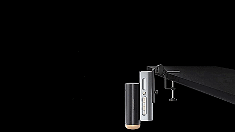 GIF shows the Lovense Solace Pro in its table clamp and fastened to a desk. The stroker has a full range of motion and can adjust to any angle when fastened to a desk. | Kinkly