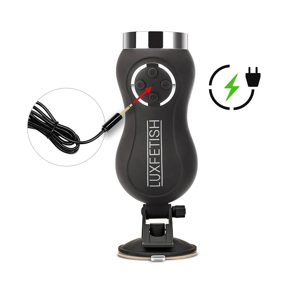 The Lux Fetish Remote-Controlled Rechargeable Compact Thrusting Machine base shown where the charging cable plugs in. It plugs in in the center of all of the four buttons on the machine. | Kinkly Shop