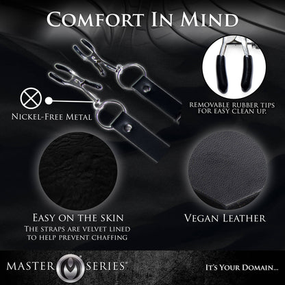 Collage of different features of the Master Series Labia Spreader with Clamps. Text and images showcase: "Nickel-free metal. Removable rubber tips for easy clean up. Easy on the skin. The straps are velvet-lined to prevent chaffing. Vegan leather." | Kinkly Shop