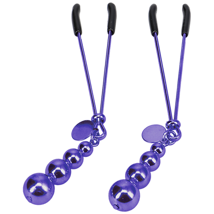 Close-up on the tweezer-style nipple clamps that are included within the The VIP Room BDSM Set | Kinkly Shop