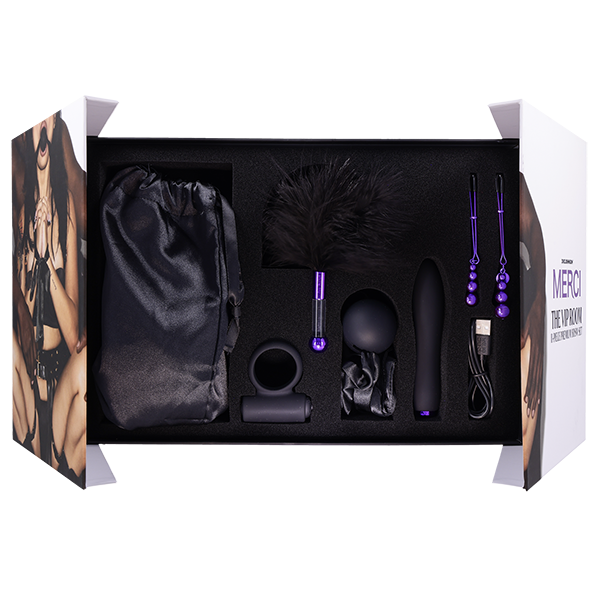 The packaging of the The VIP Room BDSM Set is opened, showcasing all of the items in the kit resting within their storage spots inside of the box | Kinkly Shop