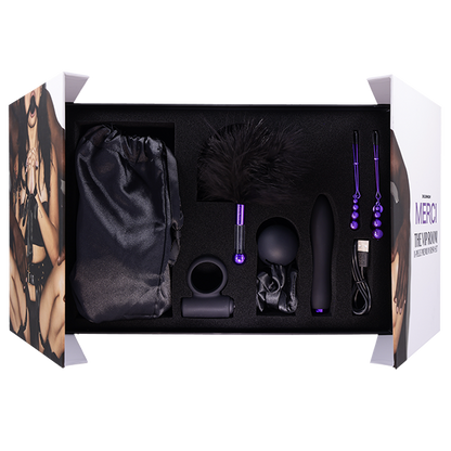 The packaging of the The VIP Room BDSM Set is opened, showcasing all of the items in the kit resting within their storage spots inside of the box | Kinkly Shop