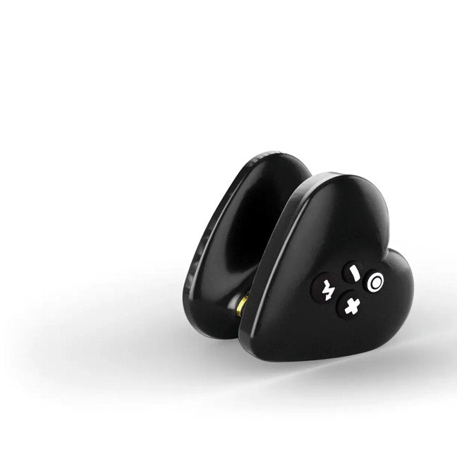 The Mystim Heart's Desire at an angle, showcasing its heart-shaped design, the four-buttons on one side, and the unique internal plastic thin diameter that makes it easy to grip. | Kinkly Shop