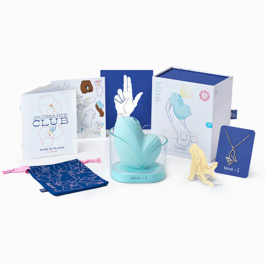 The Jouissance Club Mint Biird Namii version with everything it comes with. There's the additional necklace, pin, pleasure guide, and art print. | Kinkly Shop