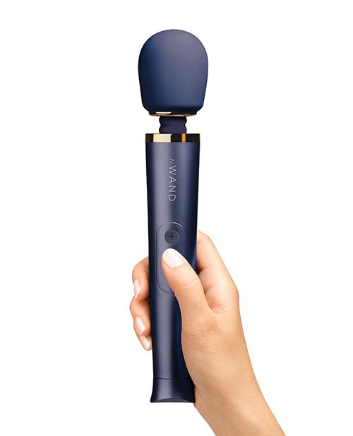 A hand holds the Le Wand Petite Rechargeable in Navy Blue | Kinkly Shop