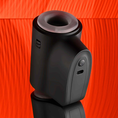 The Playboy Come Along with the powered unit showing towards the camera. There's a charging port for the toy right underneath the toy's power button on this large, protruding side. | Kinkly Shop