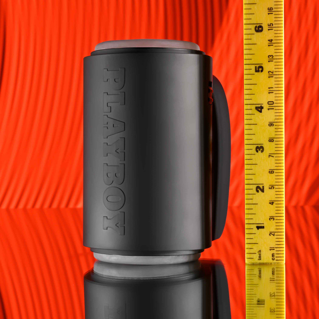 The Playboy Come Along shown next to a yellow measuring tape. The sex toy is about 6" in total length. | kinkly Shop