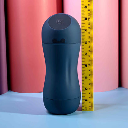 The Playboy Gusto shown next to a measuring tape. The stroker is about 8.5" tall. | Kinkly Shop
