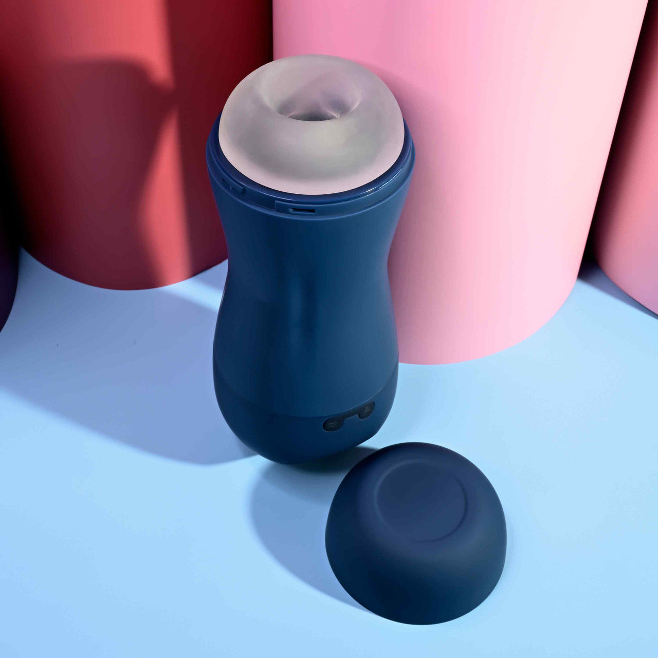 Top down view of the Playboy Gusto sitting next to its lid. The entrance to the stroker is a non-realistic entrance with a wide opening. | Kinkly Shop