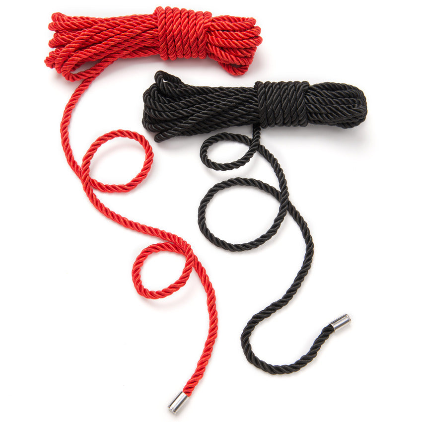 The "Restrain Me" Bondage Rope Twin Pack red and black ropes shown next to each other, showcasing their beautiful contrasting colors | Kinkly Shop