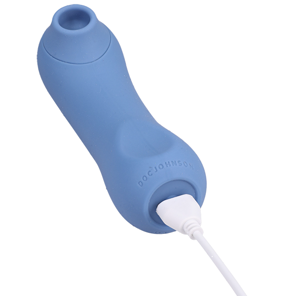 Close-up on the base of the Ritual Bliss. The magnetic charging cable is plugged into the base, showcasing how the sex toy charges. | Kinkly