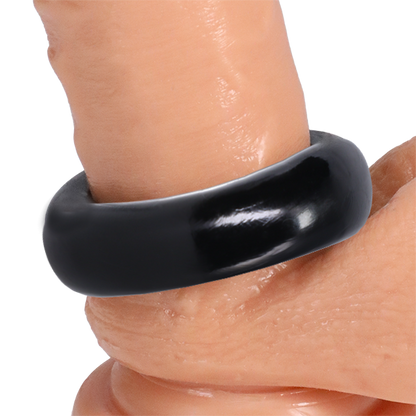 The Rock Solid The Donut 4X shown wrapped around the base of a realistic dildo | Kinkly Shop