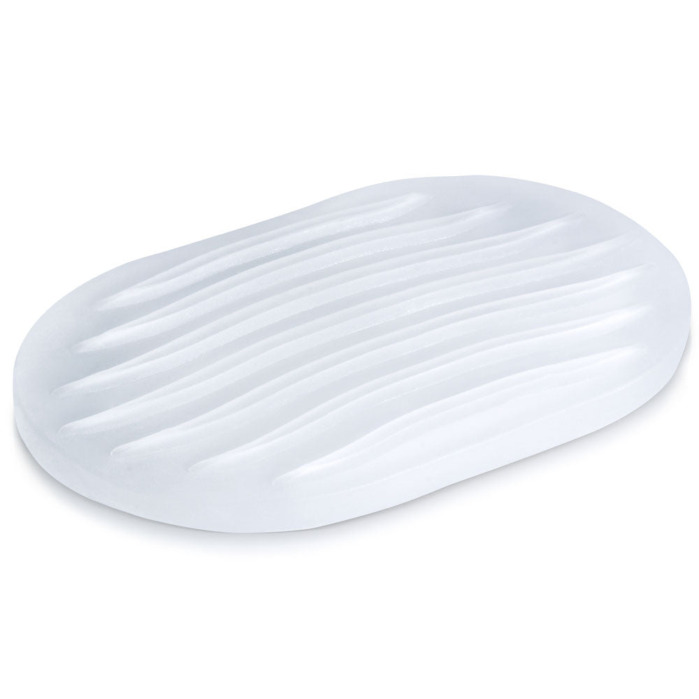 The textured pad of the Screaming O Jackits Stroker Pad laying flat on a white surface. There is ribbing on the surface of the stroker pad that looks like it would feel nice. | Kinkly Shop
