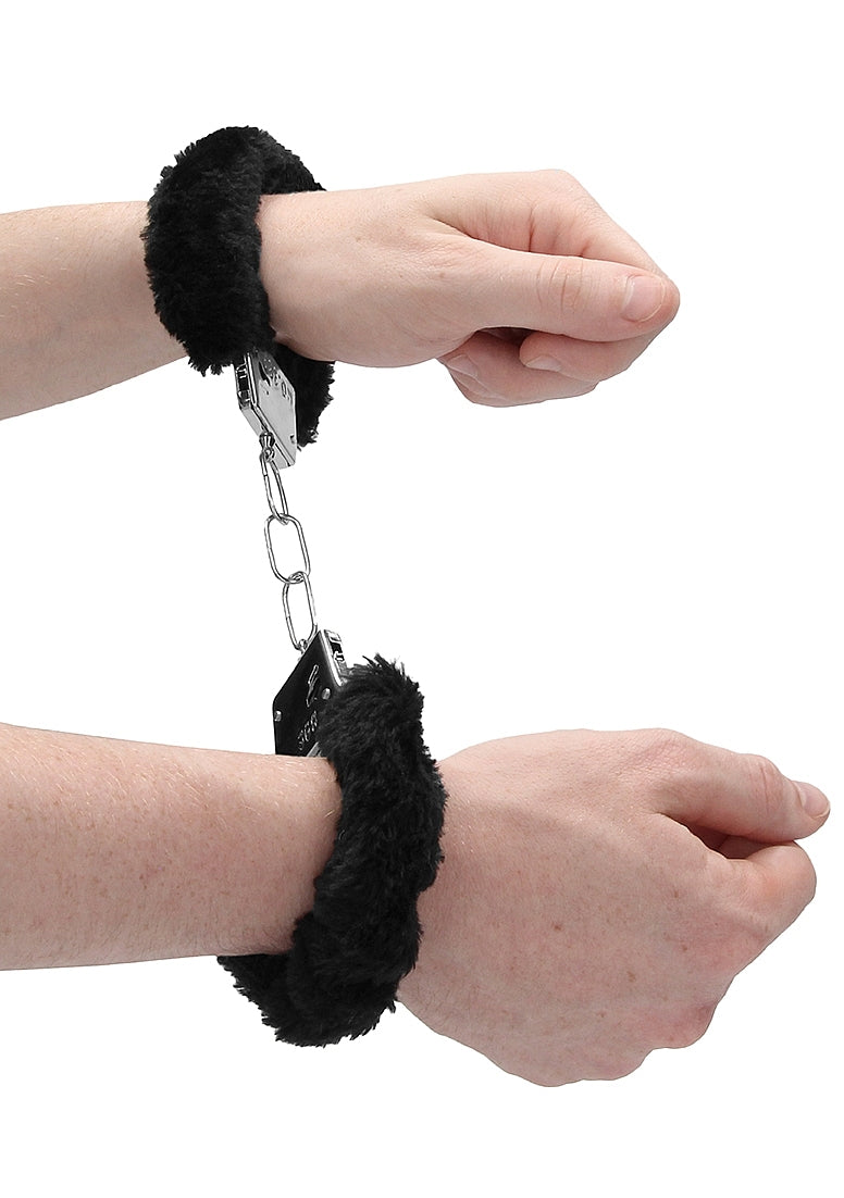Two hands bound in the Ouch! Furry Handcuffs. There's 3 links of chain in-between the two cuffs. | Kinkly Shop