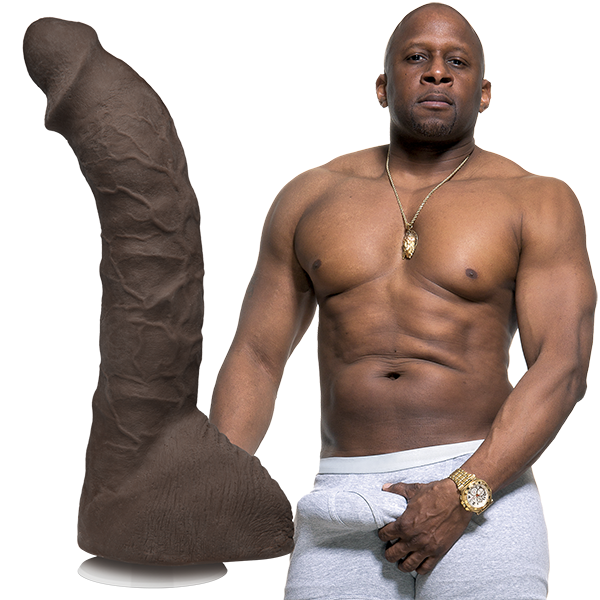 A shirtless Prince shown next to the Signature Cocks - Prince Yahshua dildo. The dildo is lifecast directly from his own length. | Kinkly Shop